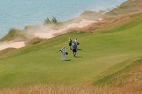 Golfers walking on a golf course