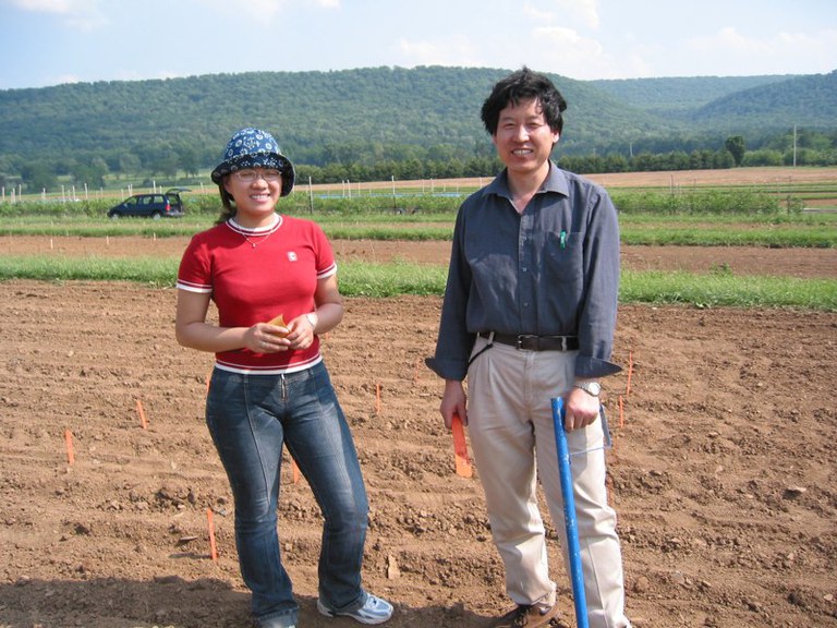 Huan and Jihong out in the field