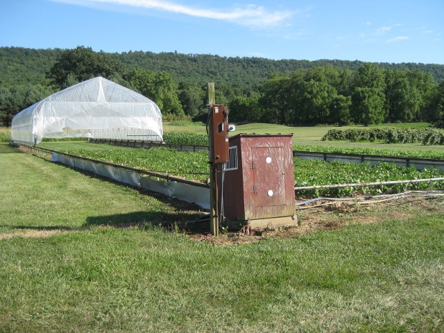 Rainout shelter with tracks and motor house