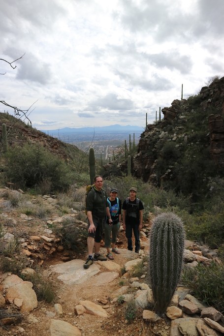 DEEPER team members Alex Bucksch (left), Molly Hanlon (middle), and Malcom Bennet (photographer) with Roots Lab member Jimmy Burridge (right) hike through the desert near Tuscon, AZ before the 2019 Phenome Meeting.
