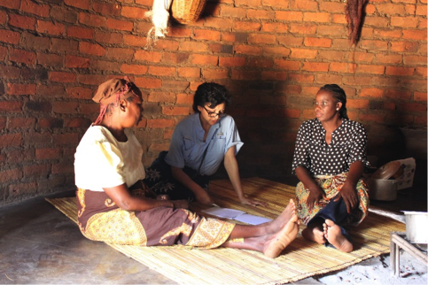 Sarudzai Nasson, left, talks with Nina Furstenau and Maria DaLuz in the kitchen house during an interview for Tasty! Mozambique