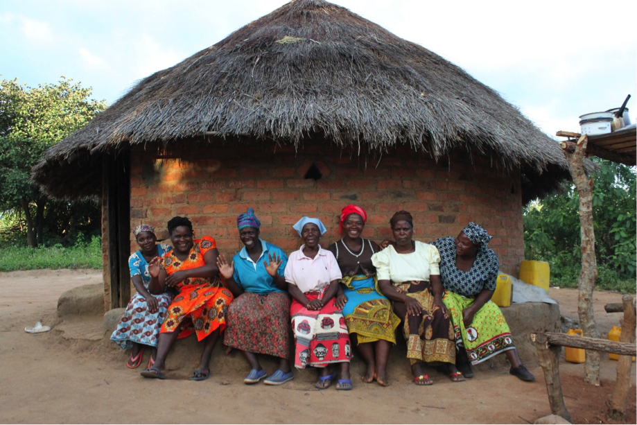 Small-holder farmers in Mozambique, prepare to participate in pilot promotional campaign for Tasty! Mozambique. The women cooked favorite recipes with common bean and soybean additions. Photo by Allison Smythe