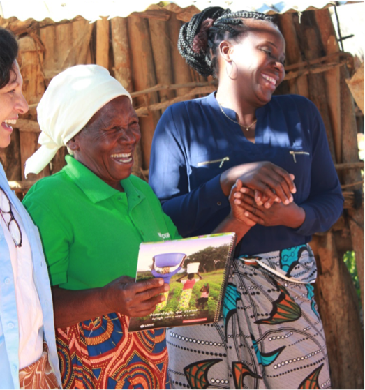 Nina Furstenau of SIL, Regina Miguel of the Rotanda pilot group and Maria da Luz Quinhentos of IIAM (left to right) admiring the new the new Tasty! Mozambique books that are part of the pilot promotional campaign.