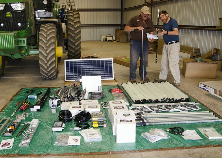 Johan Prinsloo, farm manager, and Bob Snyder, lab manager, set up soil monitoring equipment at ARBC.