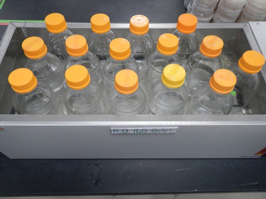 Carefully remove container from the autoclave using gloves. Place jar in water bath and allow to cool.