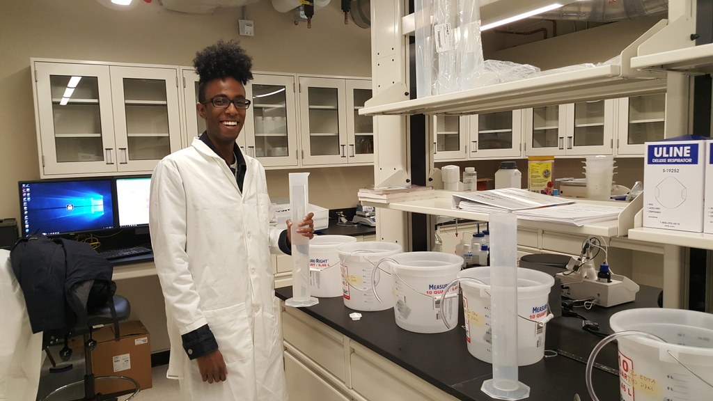 Zak Nur - First Summer intern - preparing some nutrient solutions in a brand new and almost empty lab