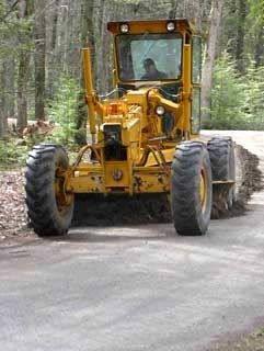 Quantifying Human-mediated Dispersal Along Roads Road grader